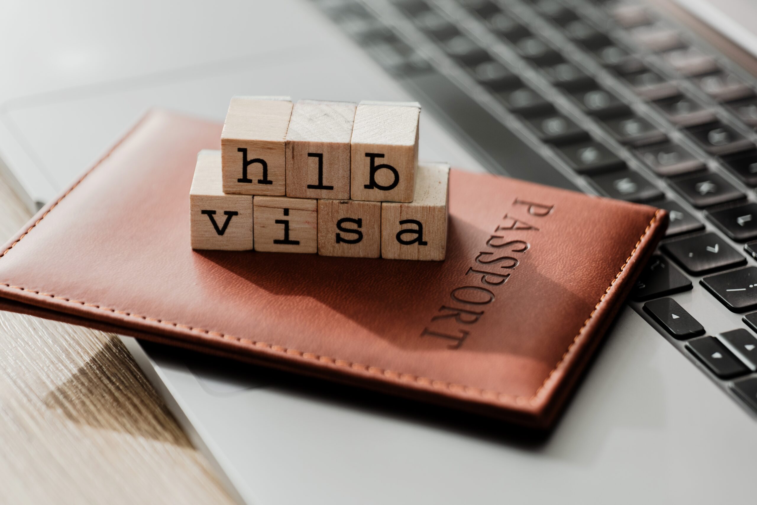 Image of a passport with H-1B Visa spelled out.