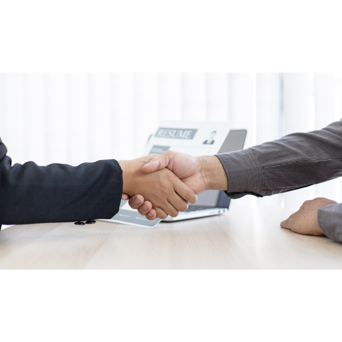two people shaking hands