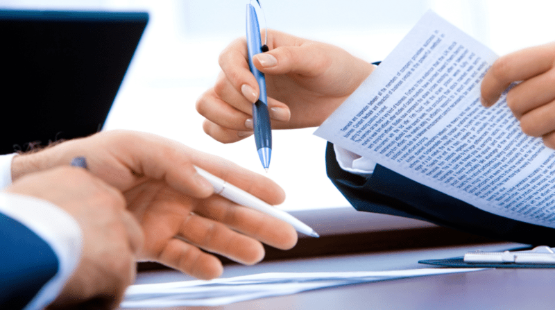 34 Hands shown signing papers and gesturing with pens.